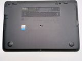 a black laptop with a blue sticker on it