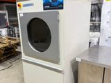 a washer and a dryer sitting in a warehouse