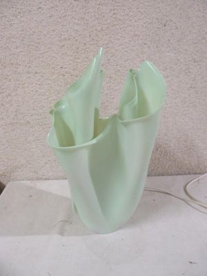 a glass vase that is sitting on a table