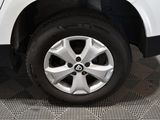 a close up of a tire on a white car