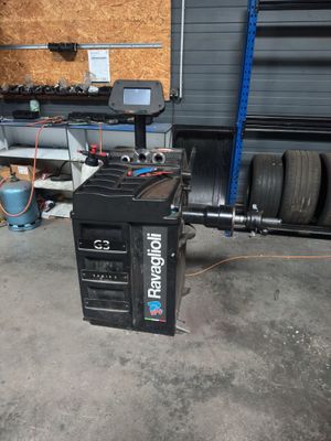a machine that is sitting in a garage next to a wall