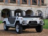 a white jeep that is parked in front of a building