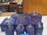 a lot of glass figurines sitting on a table