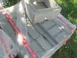 a pile of concrete blocks on the ground in the grass