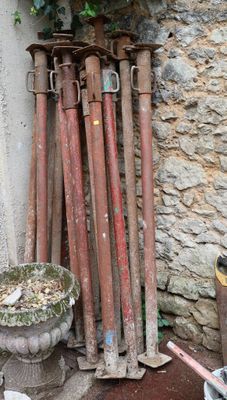 a lot of tools that are sitting outside of a building