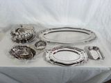 a lot of silver items sitting on a table