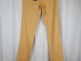 a pair of yellow pants hanging on a white curtain