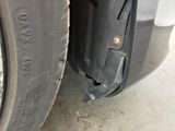 a close up of a tire on the side of a car