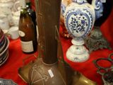 many different vases and plates on the table