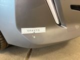 a close up of a car ' s bumper with a sticker on it
