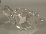pair of clear glass vases sitting on top of a white table