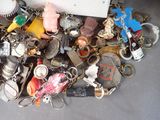 a pile of assorted key chains and other items on the floor
