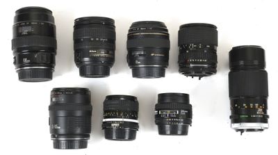 many different types of camera lenses on a white surface