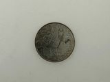 an image of a small coin on a white surface