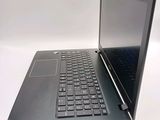 a laptop computer sitting on top of a white table