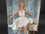 the doll is in a box with a picture of marilyn monroe on it