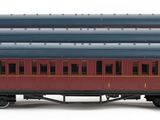 a red and blue train car and a black train car