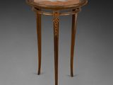a small table with a marble top and wooden legs