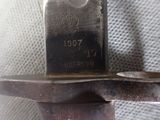 a close up of a knife with a metal handle