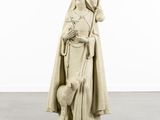 the statue of a woman with a sheep is standing in a white room