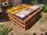 a pile of wooden pallets sitting on the ground