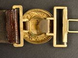 an image of a close up of a belt with a buckle on it