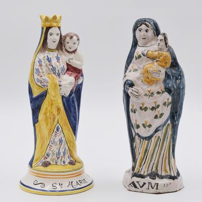 two figurines of the virgin mary and child jesus