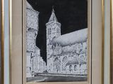 drawing of a church with a clock tower in a gold frame