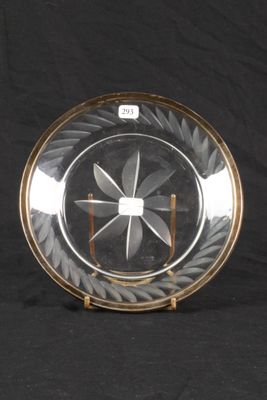 a glass plate with a design on it on a black background
