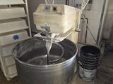 an image of a kitchen with a mixer and buckets of water