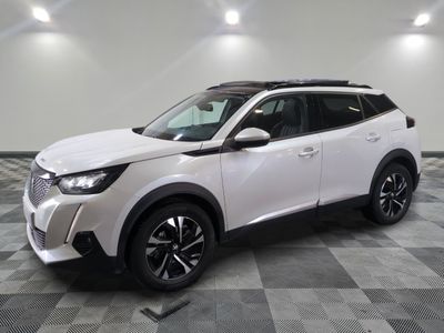 a white toyota c - hr suv parked on a checkered floor