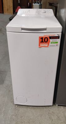 a refrigerator and a dryer sitting next to each other in a room