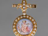 a picture of a cross with a picture of a baby on it
