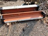 a bench that is sitting on the ground in the dirt