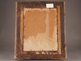 an old picture frame with a piece of brown paper on it