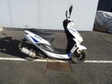 a scooter that is parked in a parking lot
