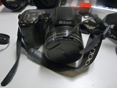 a camera that is sitting on a table next to other cameras