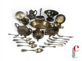a lot of spoons and silverware on the table