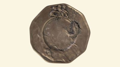 une image représentant une pièce de monnaie en bronze sur laquelle figure le visage d'une femme