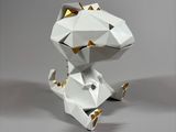 a paper sculpture of a dog that is sitting on the ground