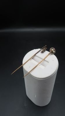 a close up of a pair of chopsticks sitting on top of a white container