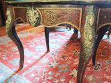 a small table with a clock on top of it