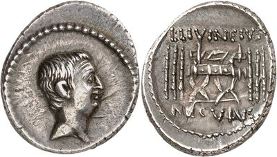 a silver coin with an image of a man on it