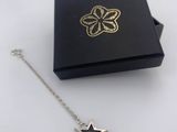 a black box with a silver star charm on it