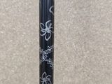 a close up of a baseball bat with a design on it