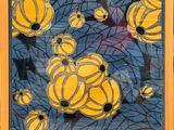 painting of yellow and black flowers in a yellow frame on a blue background