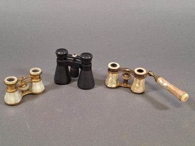 three different types of binoculars are shown on a gray surface