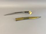 a knife and a knife blade sitting on a table