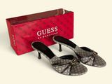 guccissi women ' s shoes in grey and black with a red box