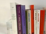 a lot of books that are sitting on a table